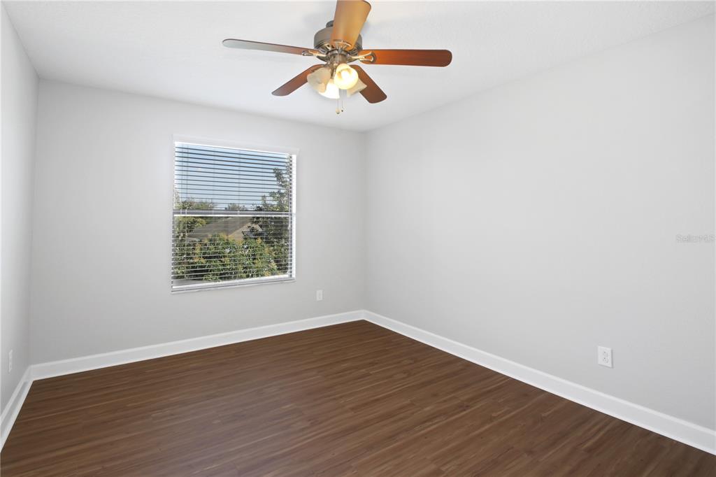 2069 Nerva Road Winter Garden, FL 34787 - Photo 23 of 41 a view of room with window ceiling fan and wooden floor