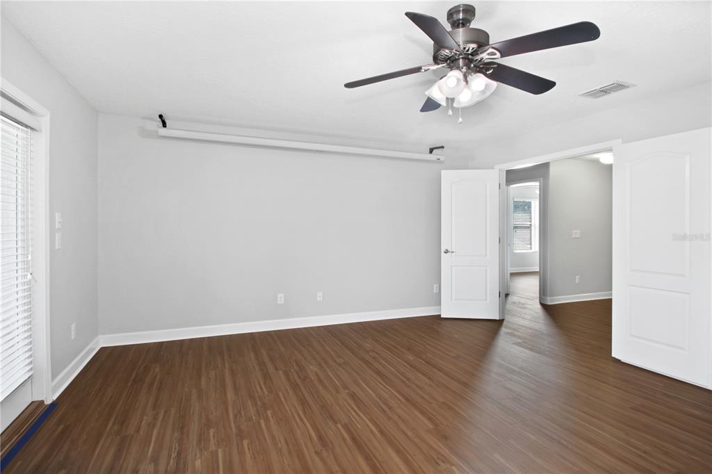 2069 Nerva Road Winter Garden, FL 34787 - Photo 26 of 41 a view of an empty room with wooden floor