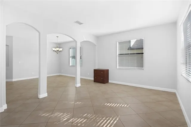 a view of an empty room with a cabinet