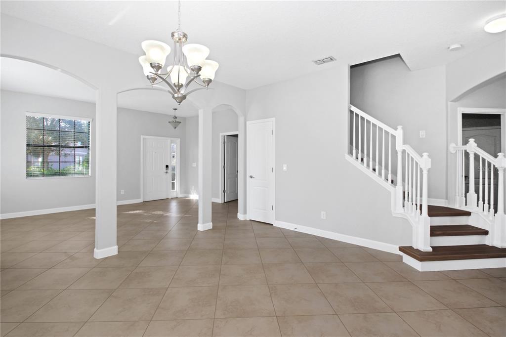 2069 Nerva Road Winter Garden, FL 34787 - Photo 4 of 41 a view of entryway with chandelier