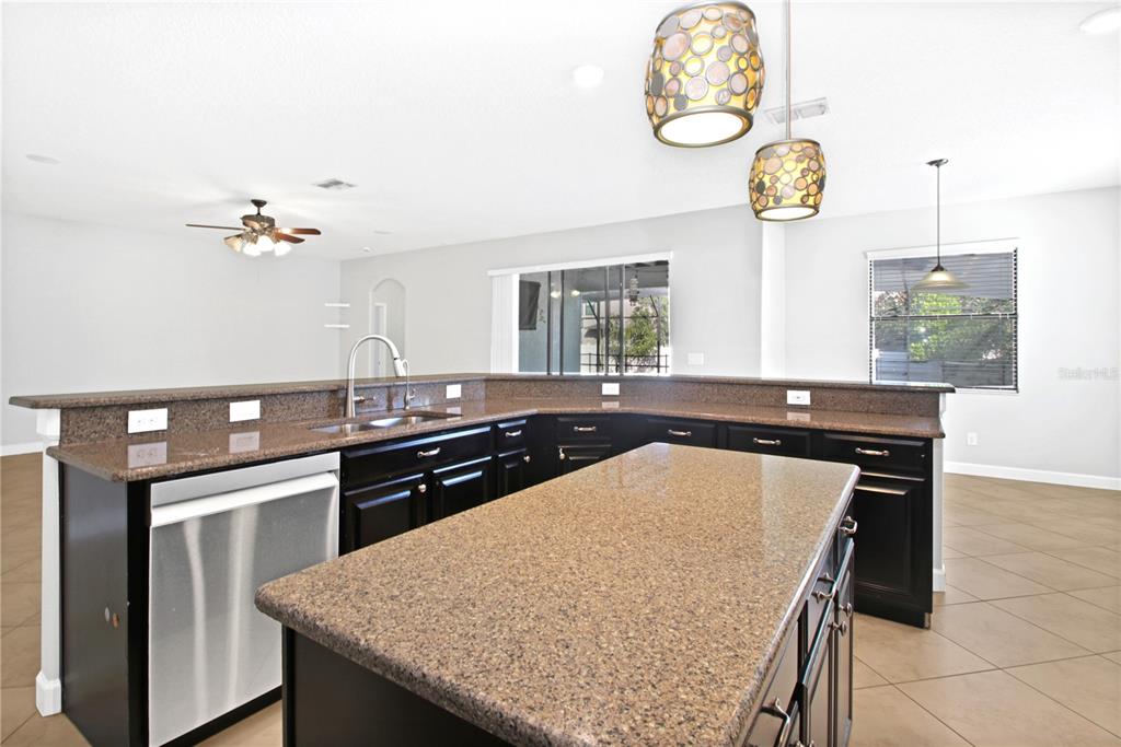 2069 Nerva Road Winter Garden, FL 34787 - Photo 7 of 41 a kitchen with a table and a stove