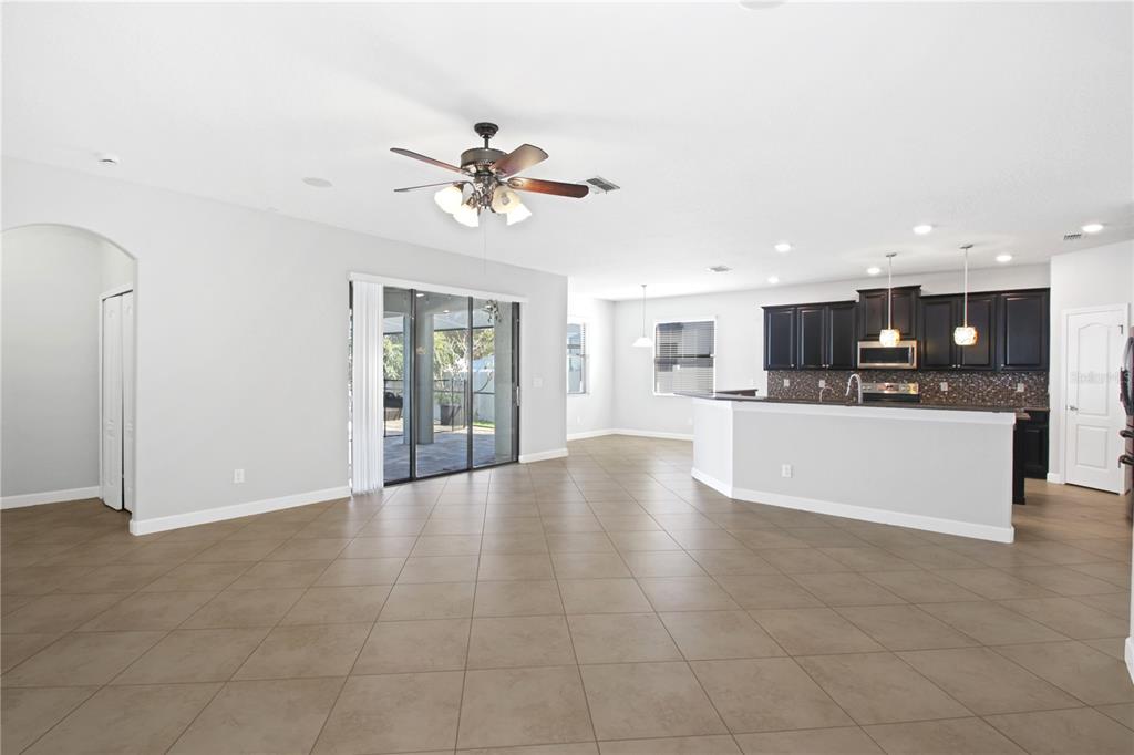2069 Nerva Road Winter Garden, FL 34787 - Photo 9 of 41 a view of an empty room with kitchen and window