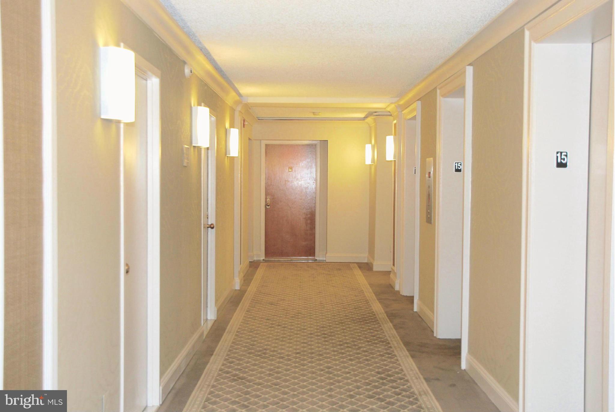 1800 Old Meadow Road, Unit 1510 McLean, VA 22102 - Photo 10 of 25 a view of a bathroom from the hallway