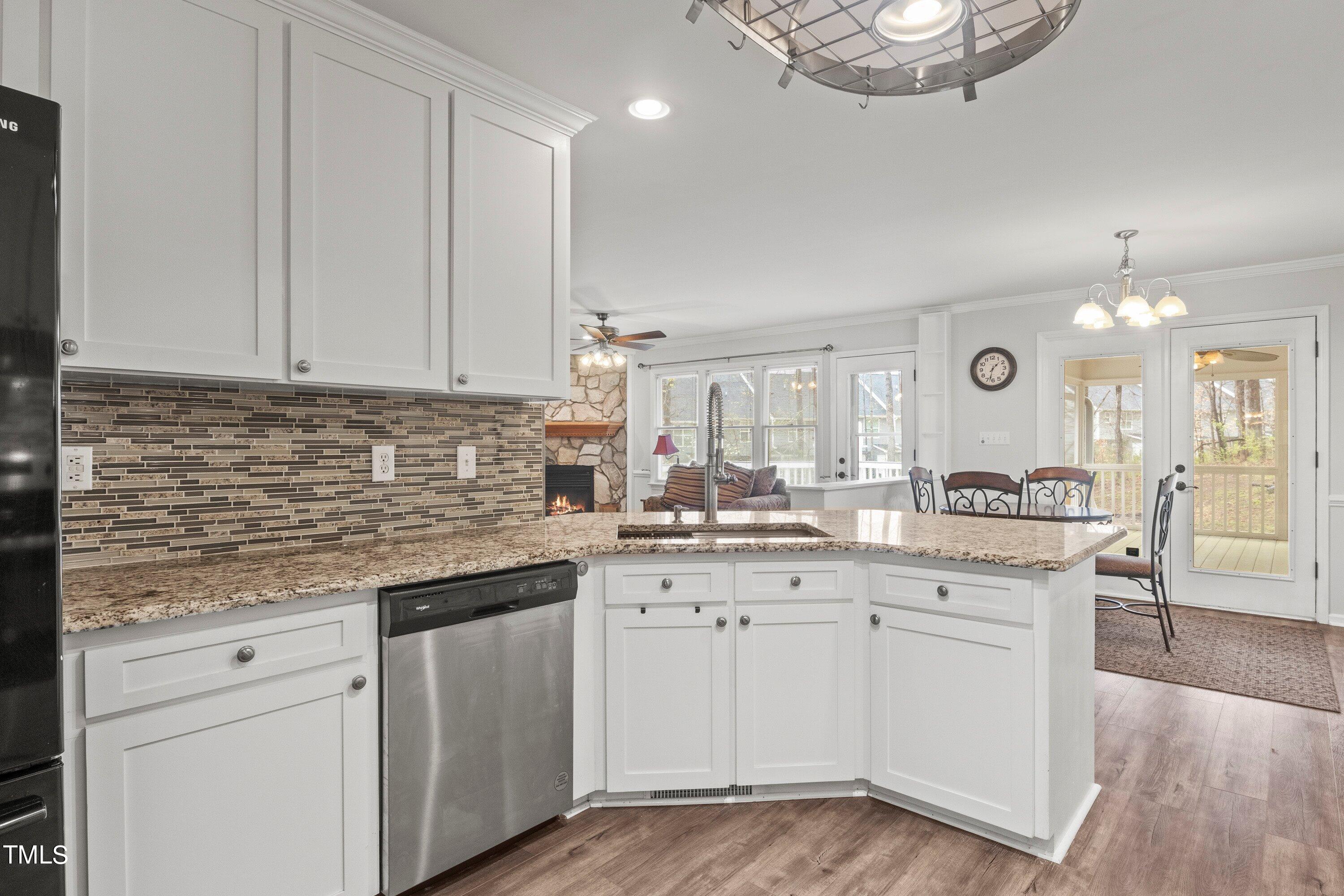 505 Castleberry Road Clayton, NC 27527 - Photo 16 of 38 a kitchen with a sink cabinets and window