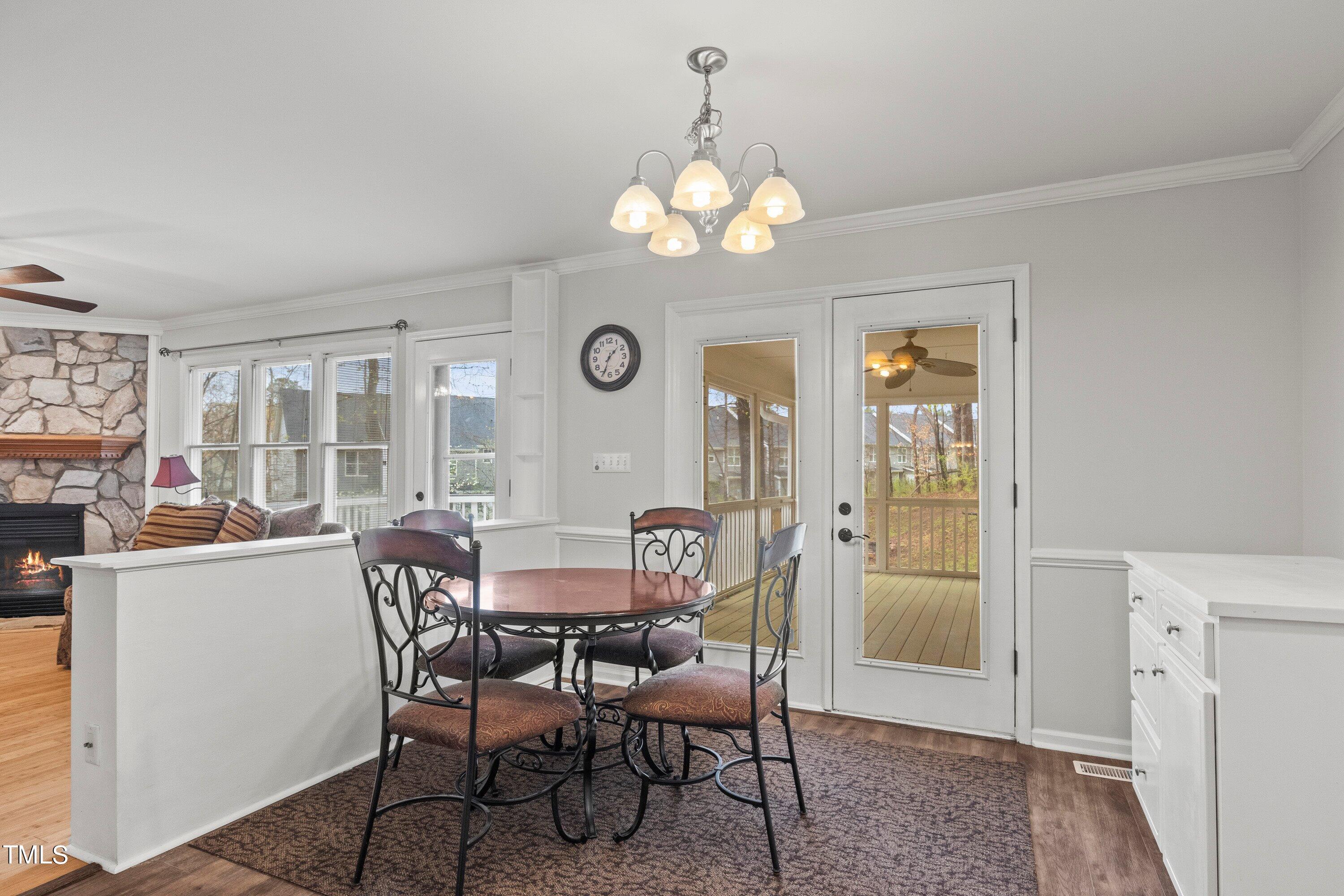 505 Castleberry Road Clayton, NC 27527 - Photo 20 of 38 a view of a dining room with furniture window and wooden floor