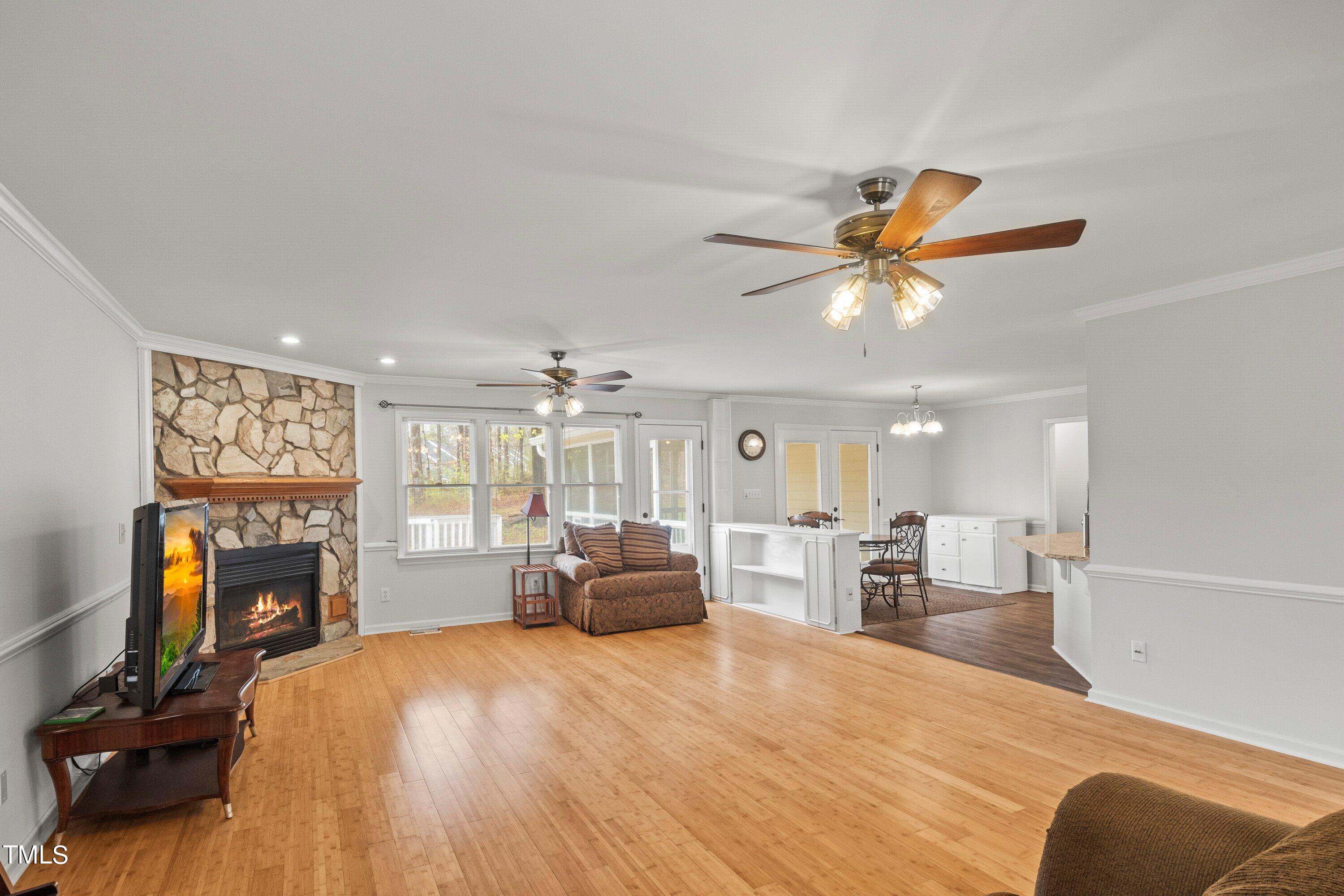 505 Castleberry Road Clayton, NC 27527 - Photo 22 of 38 a living room with furniture and a fireplace