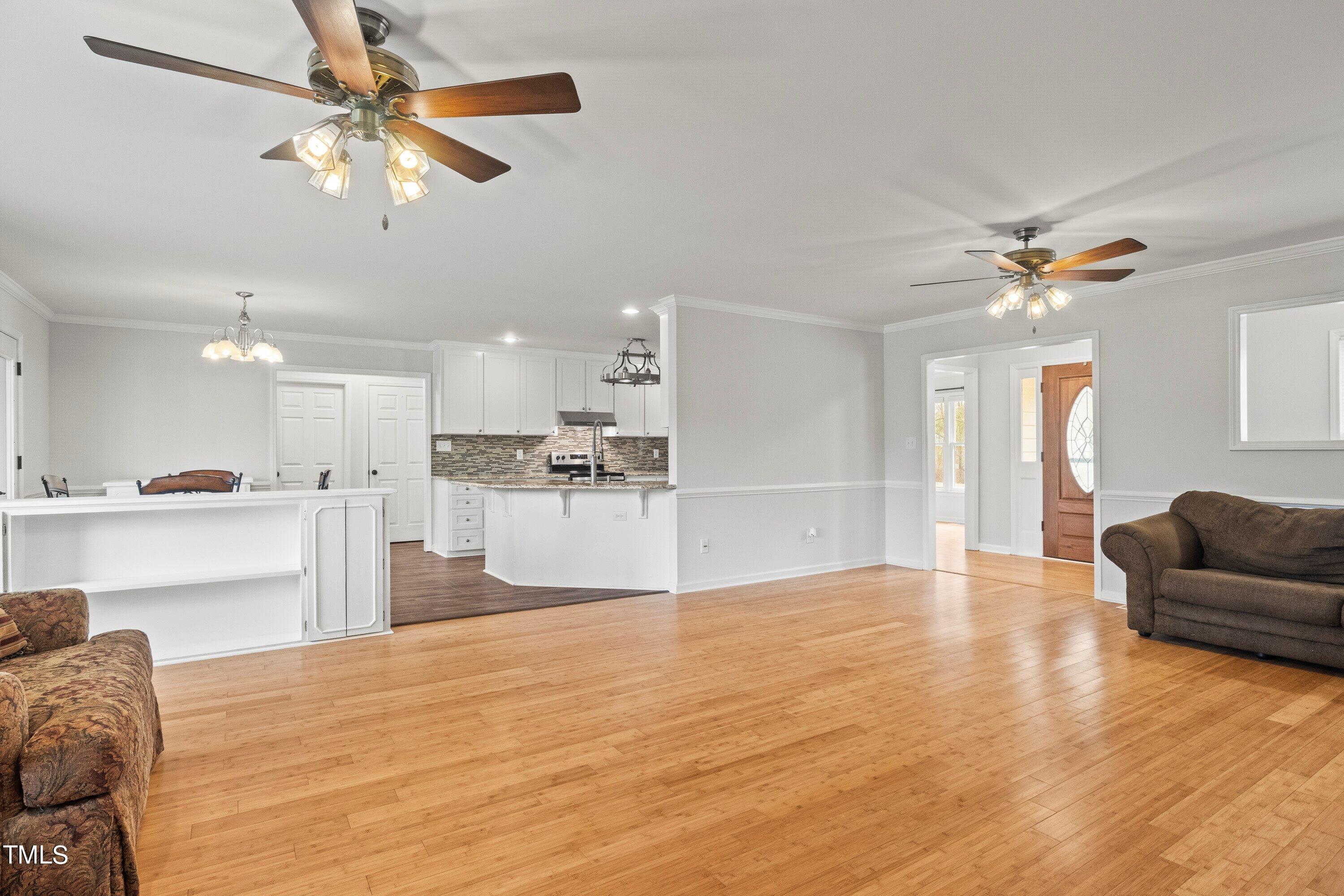 505 Castleberry Road Clayton, NC 27527 - Photo 23 of 38 a view of kitchen with furniture and a chandelier fan