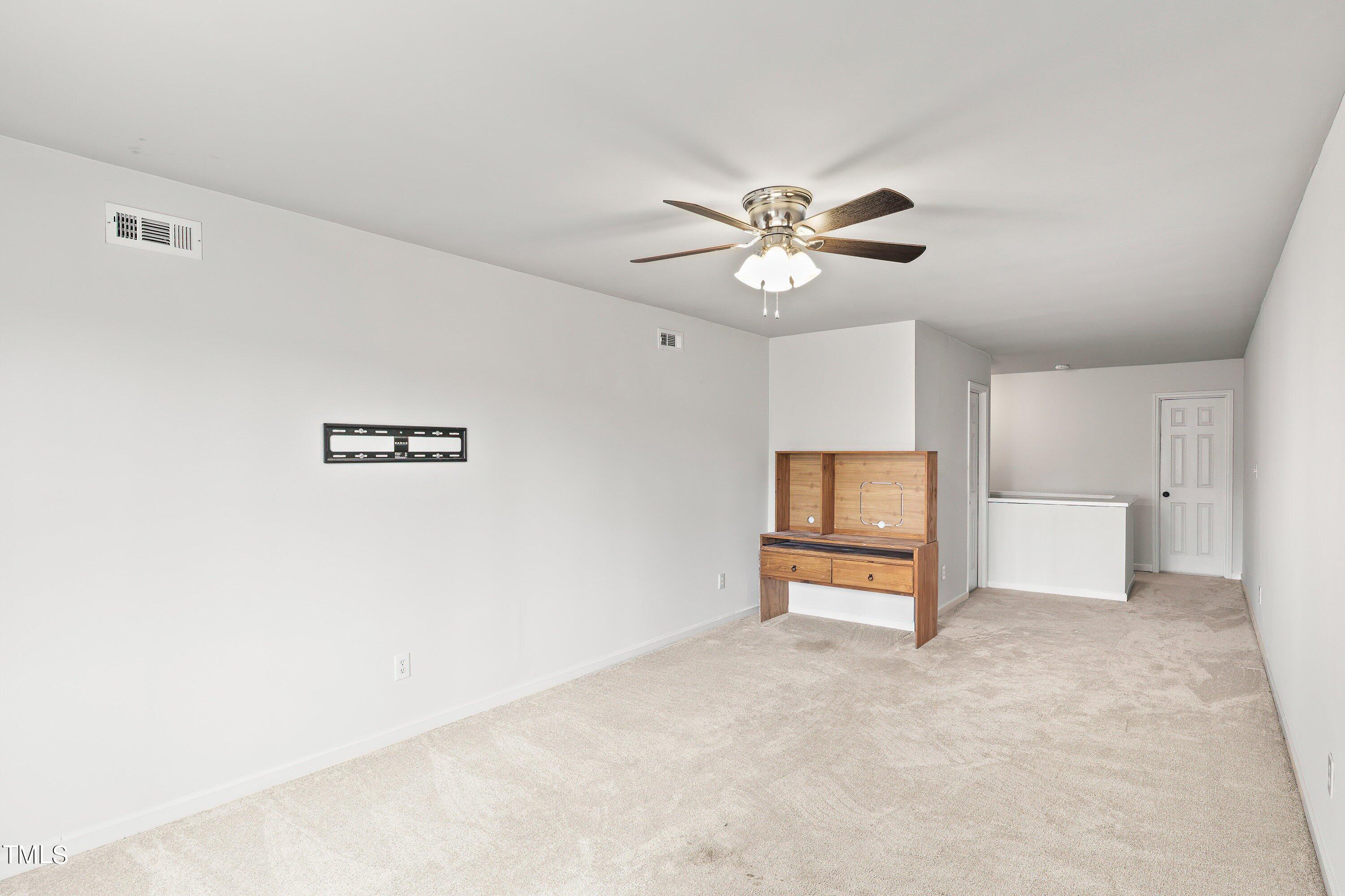 505 Castleberry Road Clayton, NC 27527 - Photo 32 of 38 a view of an empty room with a window