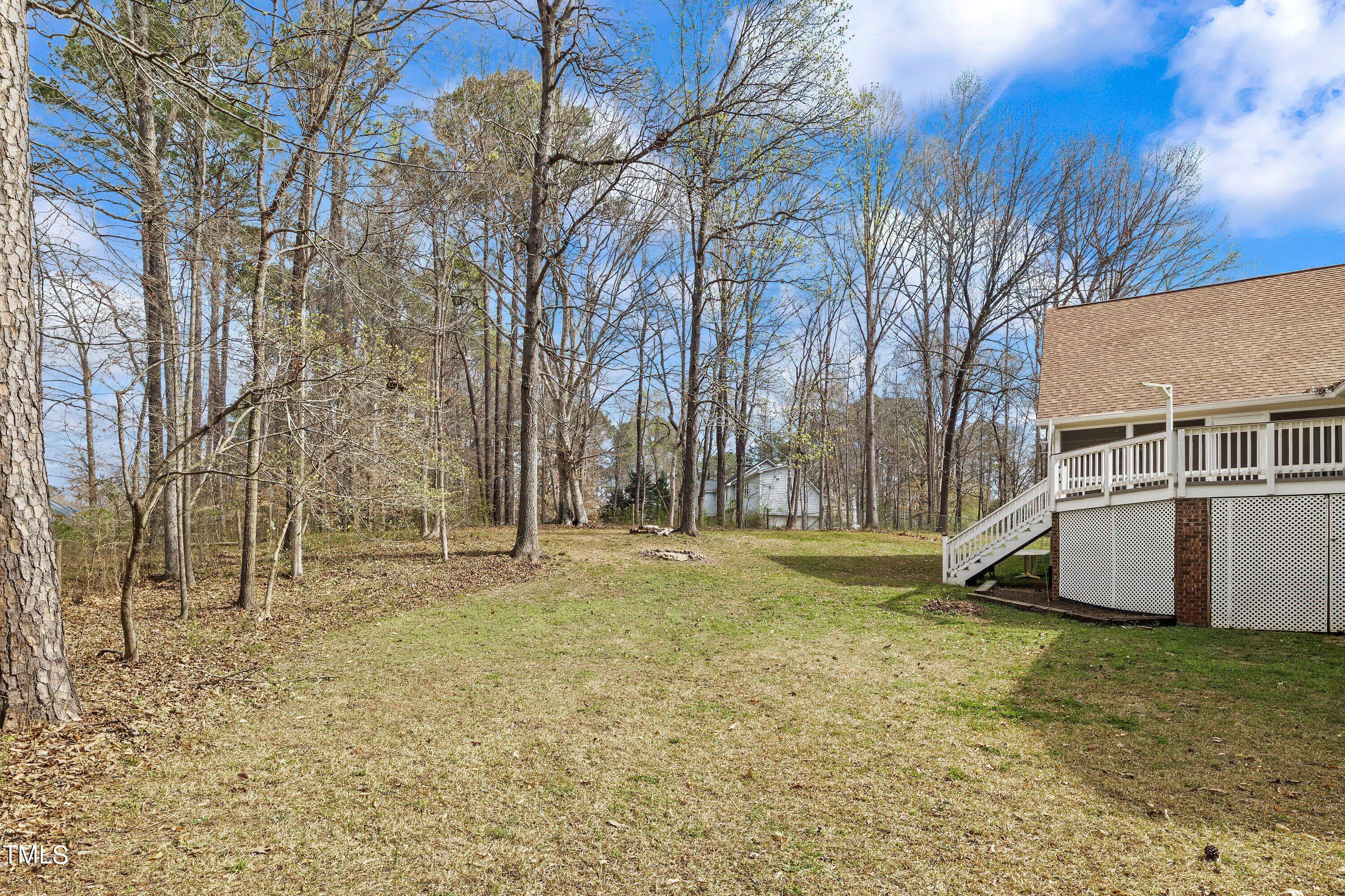 505 Castleberry Road Clayton, NC 27527 - Photo 36 of 38 a backyard of a house with lots of green space