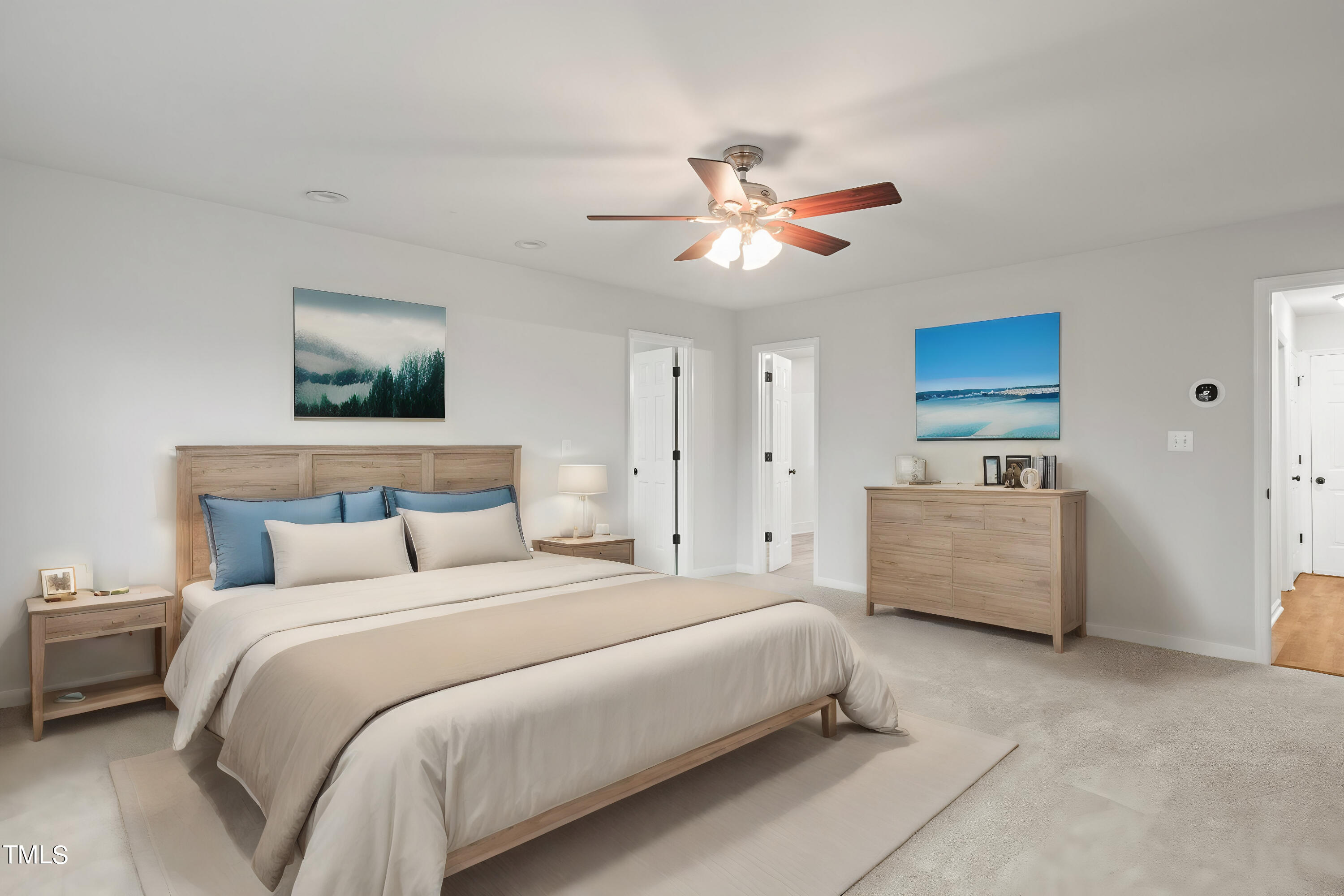 505 Castleberry Road Clayton, NC 27527 - Photo 6 of 38 a spacious bedroom with a bed and a couch