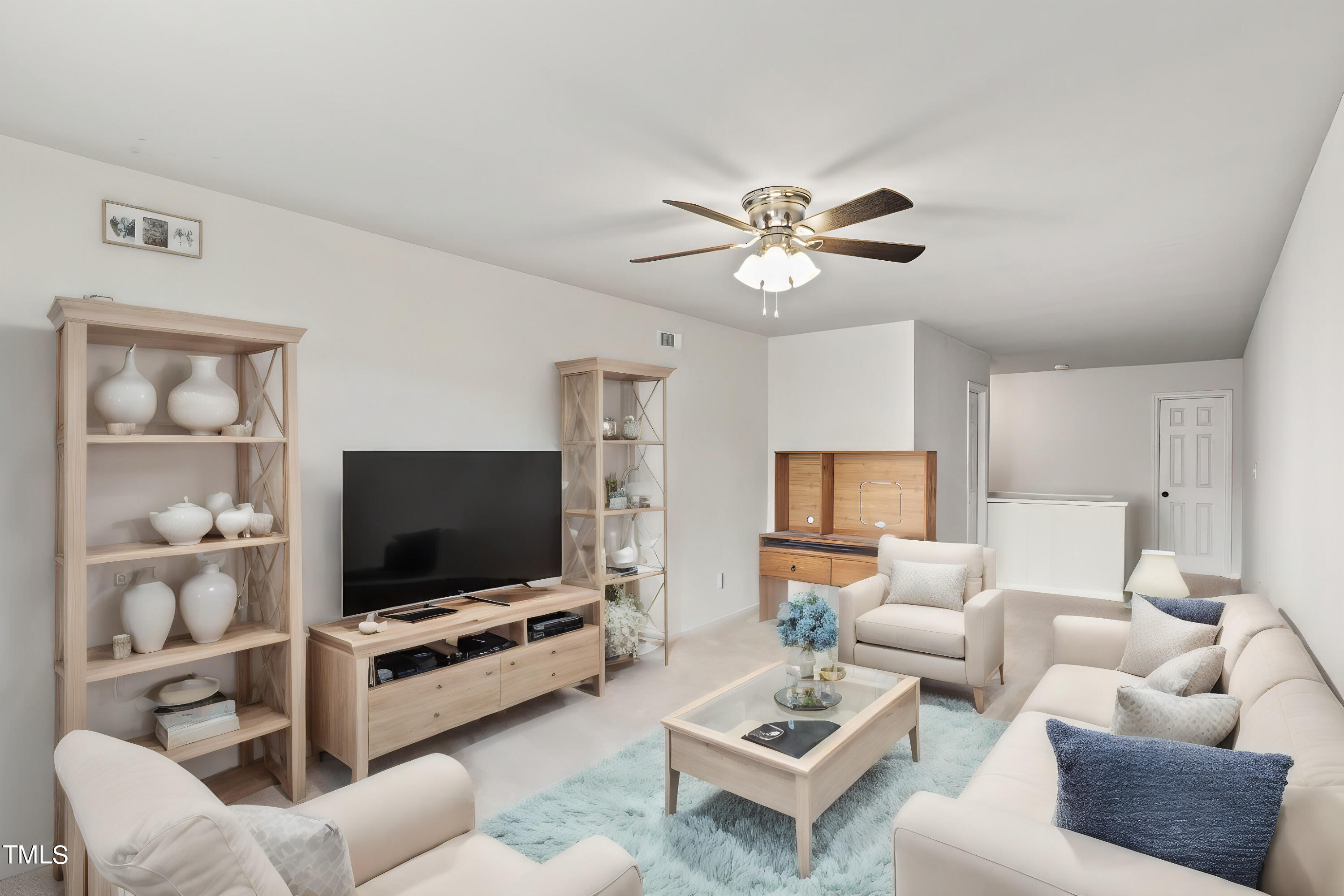 505 Castleberry Road Clayton, NC 27527 - Photo 7 of 38 a living room with furniture and a flat screen tv