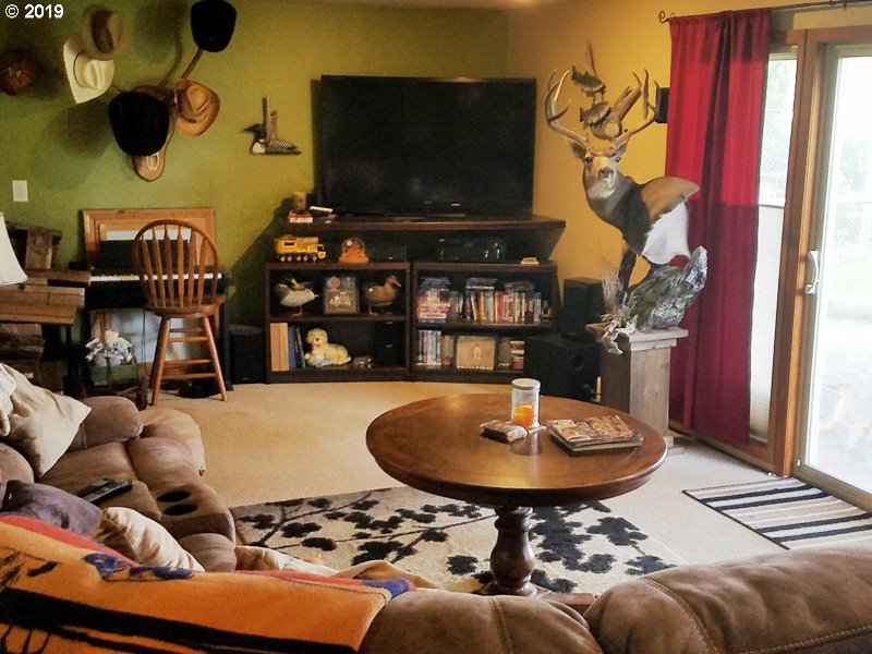 23805 South Rondevic Road Canby, OR 97013 - Photo 14 of 15 a living room with furniture and a flat screen tv