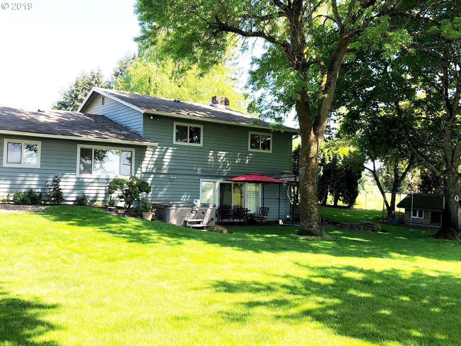 23805 South Rondevic Road Canby, OR 97013 - Photo 2 of 15 a front view of house with yard and outdoor seating