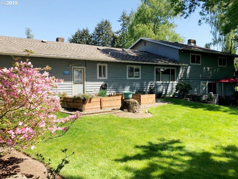 23805 South Rondevic Road Canby, OR 97013 - Photo 4 of 15 a view of a house with backyard porch and sitting area