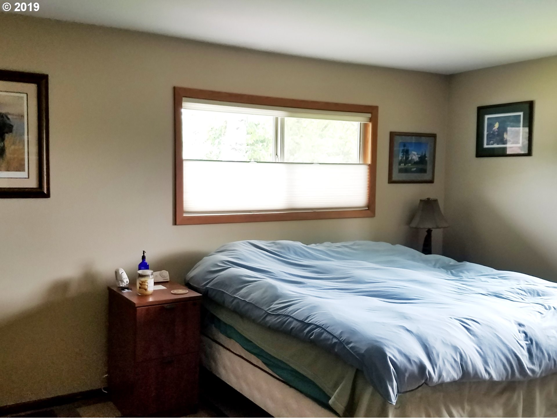 23805 South Rondevic Road Canby, OR 97013 - Photo 8 of 15 a bedroom with a bed and a window