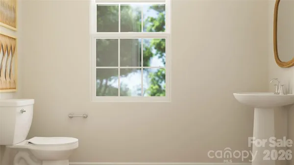 a room with furniture and a potted plant