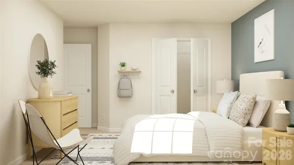 a bedroom with a bed and a dresser