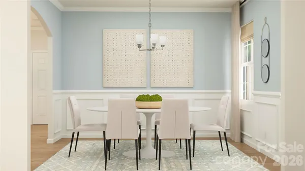 a kitchen with stainless steel appliances granite countertop a table and chairs
