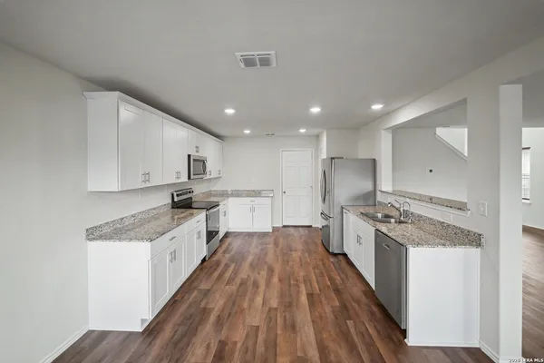 a large kitchen with a lot of counter space