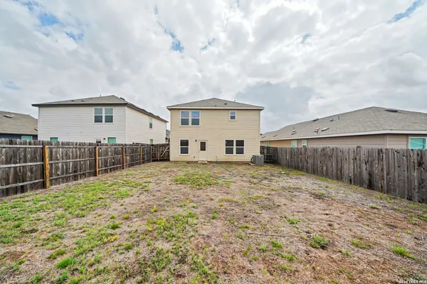 a view of a backyard of the house