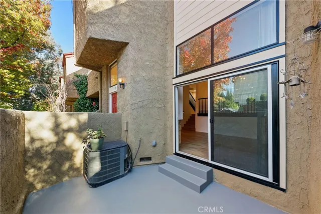 a couple of potted plants in front of building