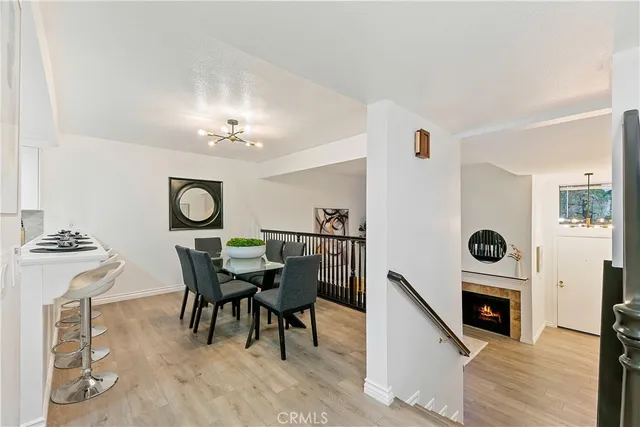 a dining room with furniture and a fireplace