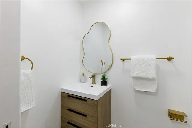a bathroom with a sink and mirror