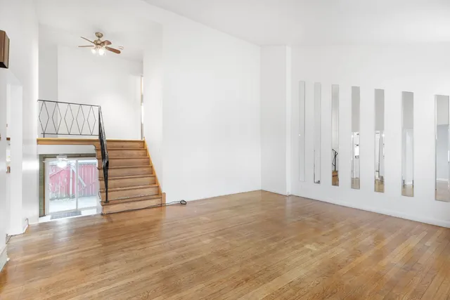 a view of an entryway with wooden floor