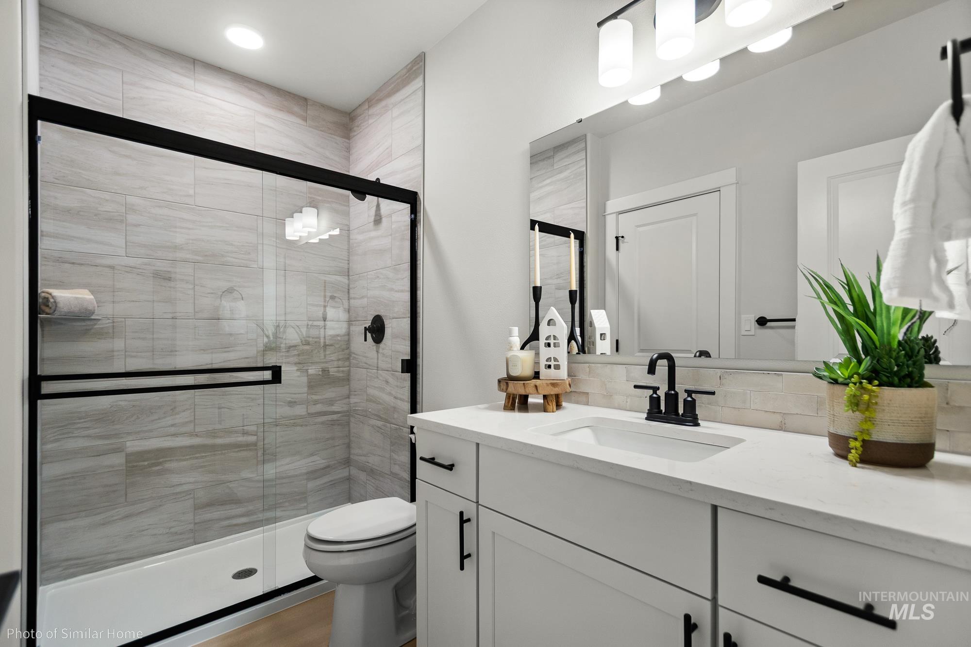 3 Tbd S Sorrel Trail Nampa, ID 83686 - Photo 12 of 17 Full bath featuring vanity, a shower stall, and backsplash