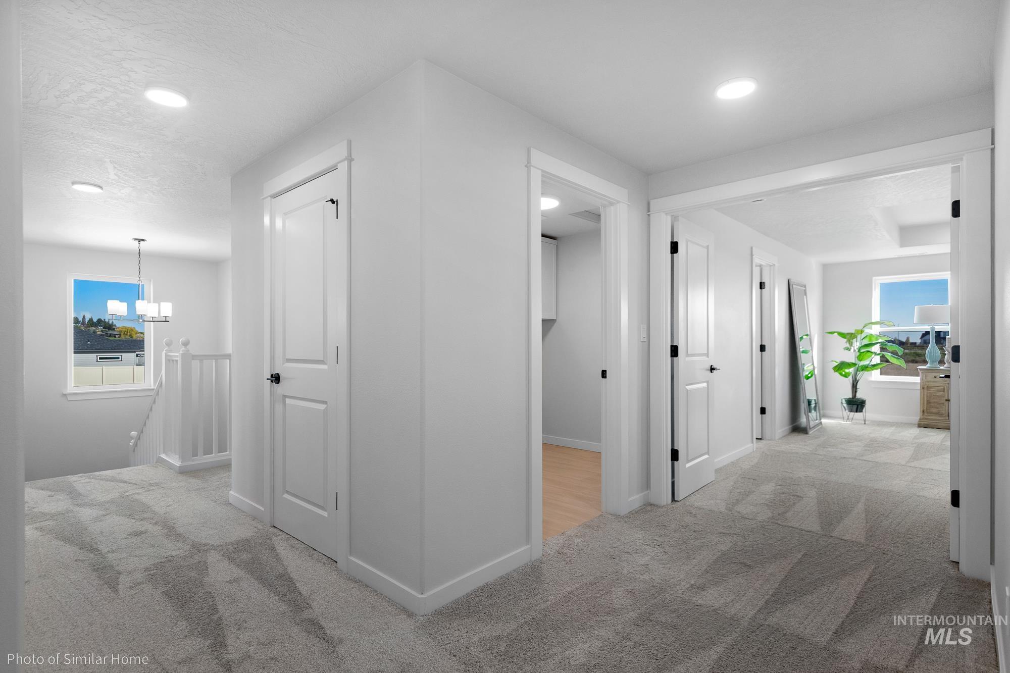 3 Tbd S Sorrel Trail Nampa, ID 83686 - Photo 15 of 17 Hall with light colored carpet, an upstairs landing, and recessed lighting