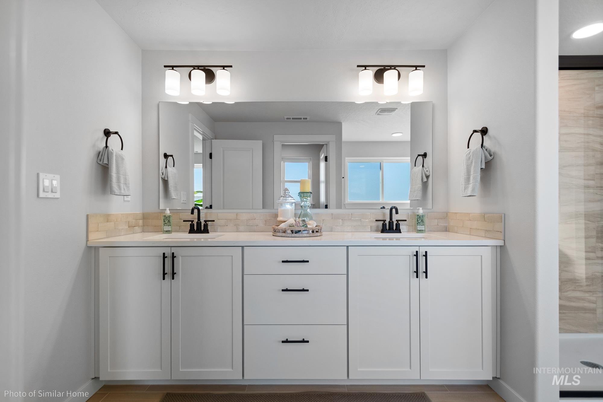 3 Tbd S Sorrel Trail Nampa, ID 83686 - Photo 6 of 17 Bathroom with double vanity and a stall shower