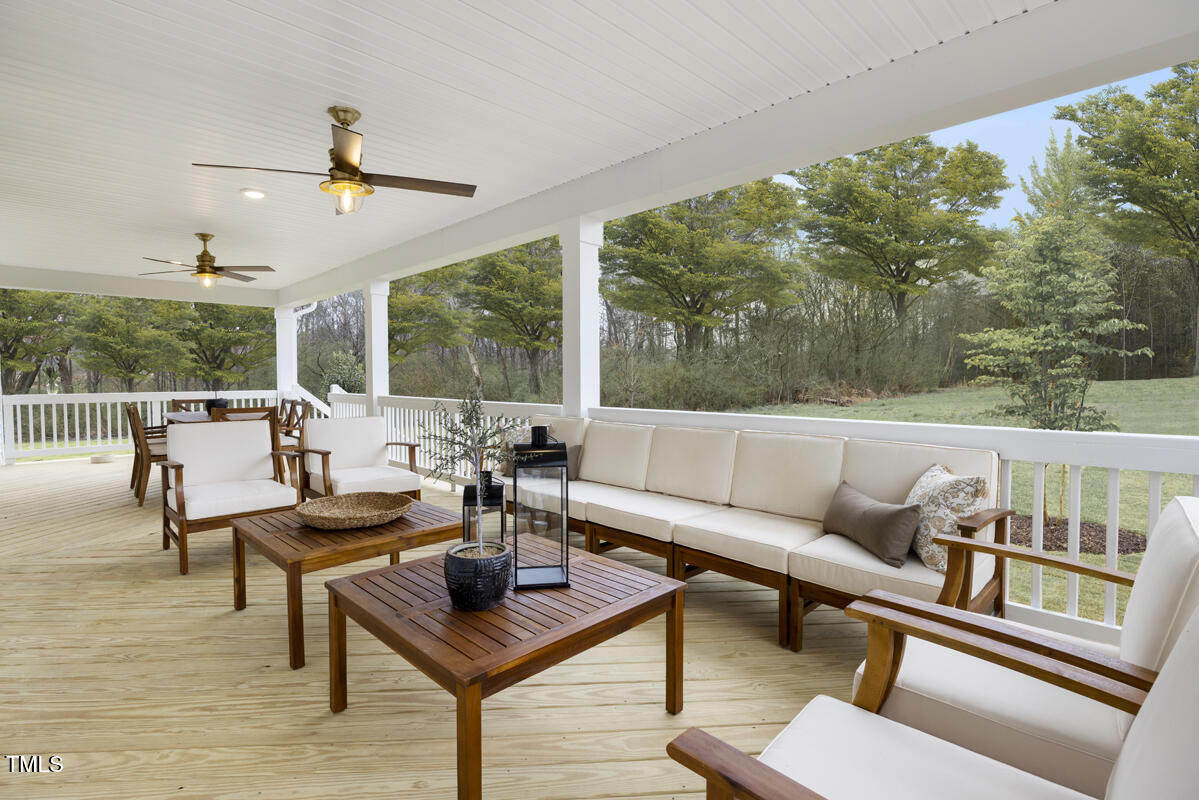 49 Alden Way Angier, NC 27501 - Photo 12 of 66 a living room with furniture and a floor to ceiling window