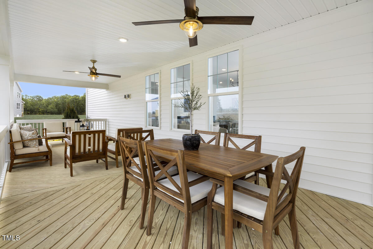 49 Alden Way Angier, NC 27501 - Photo 13 of 66 a view of a dining room with furniture and wooden floor