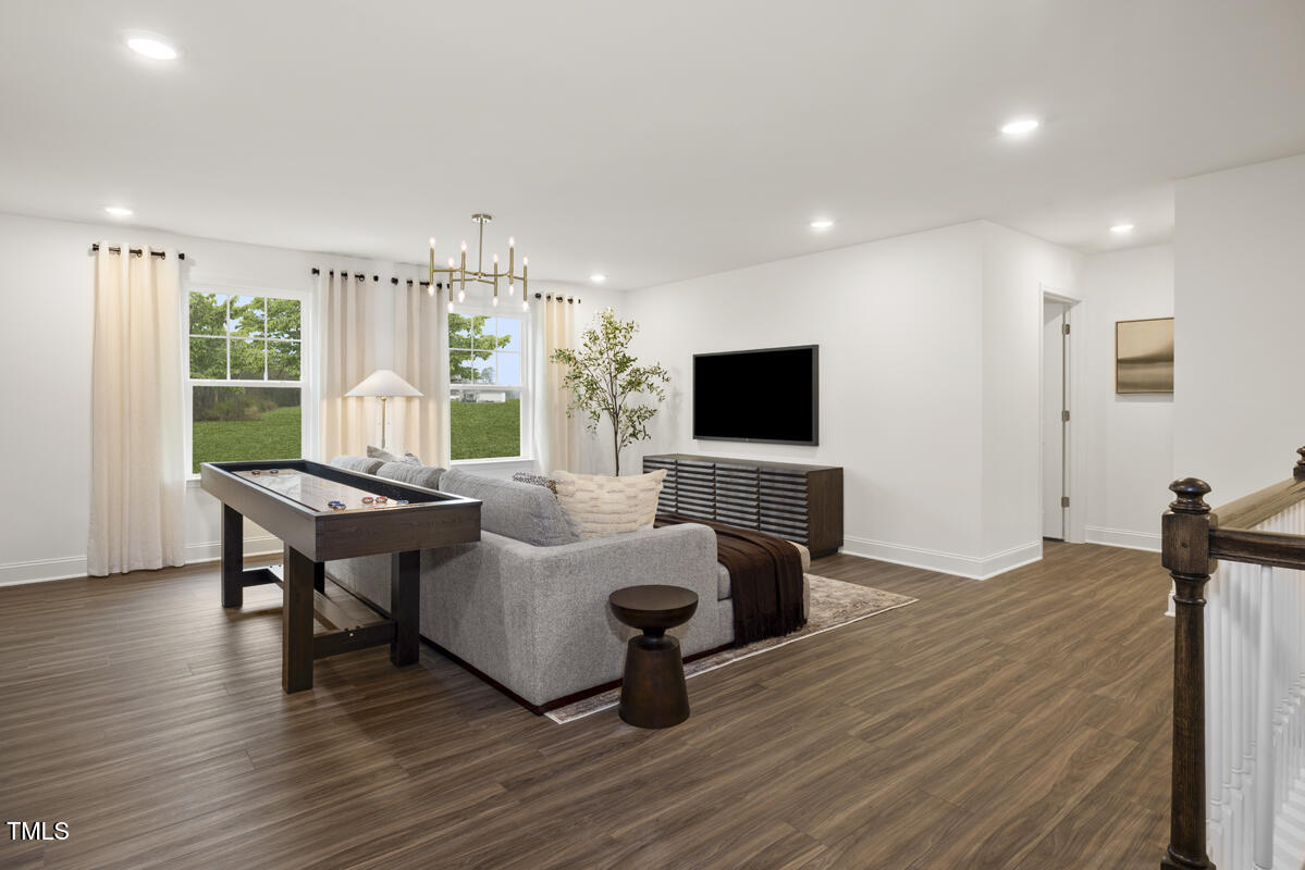 49 Alden Way Angier, NC 27501 - Photo 15 of 66 a living room with furniture and a flat screen tv