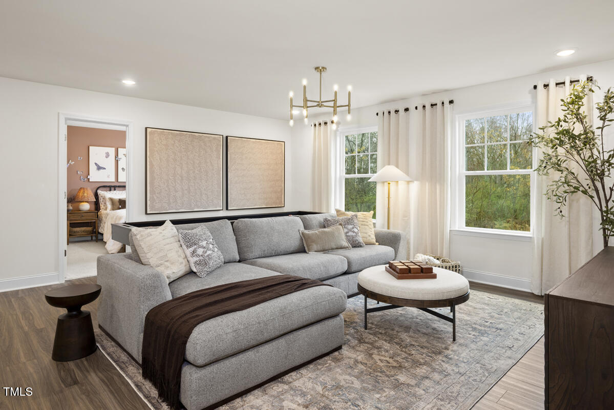49 Alden Way Angier, NC 27501 - Photo 16 of 66 a living room with furniture and a large window