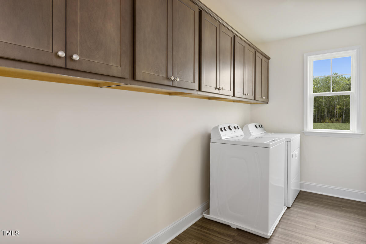 49 Alden Way Angier, NC 27501 - Photo 17 of 66 a utility room with wooden floor washer and dryer