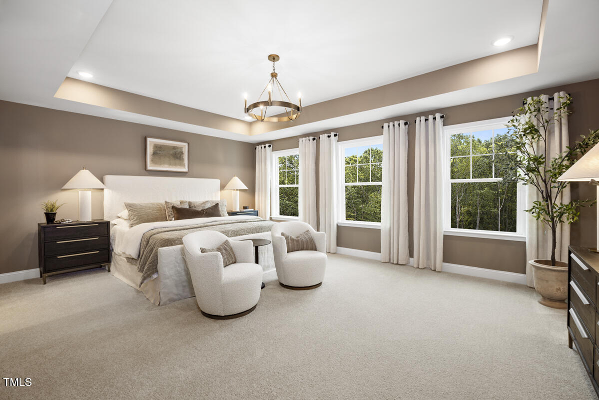 49 Alden Way Angier, NC 27501 - Photo 18 of 66 a bedroom with bed and a large window