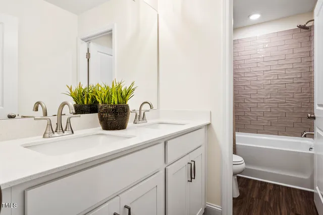 a view of kitchen with a sink and wooden floor