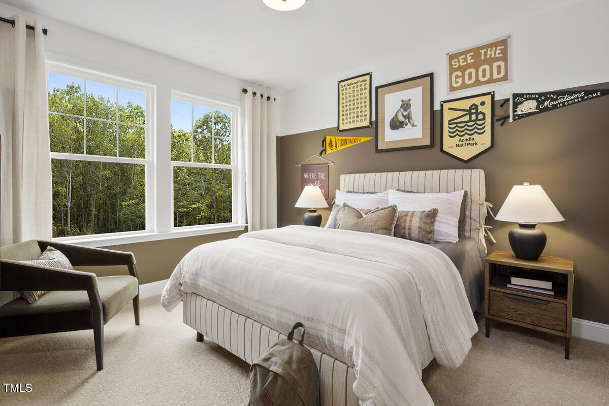 49 Alden Way Angier, NC 27501 - Photo 25 of 66 a bedroom with a bed a couch and a window