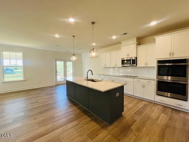 a view of a livingroom with wooden floor