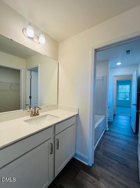 49 Alden Way Angier, NC 27501 - Photo 49 of 66 a en suite bathroom with a granite countertop sink and a mirror