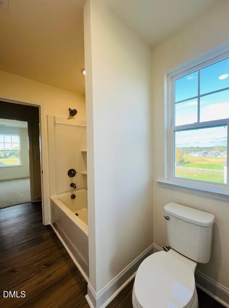 49 Alden Way Angier, NC 27501 - Photo 50 of 66 a bathroom with a toilet and a shower