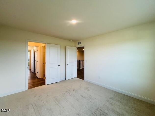 49 Alden Way Angier, NC 27501 - Photo 52 of 66 a view of a big room with closet and windows