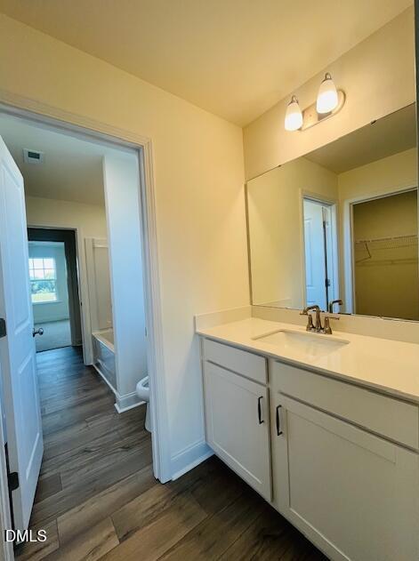 49 Alden Way Angier, NC 27501 - Photo 54 of 66 a bathroom with a double vanity sink and a mirror