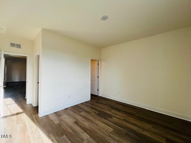 49 Alden Way Angier, NC 27501 - Photo 63 of 66 a view of empty room with wooden floor