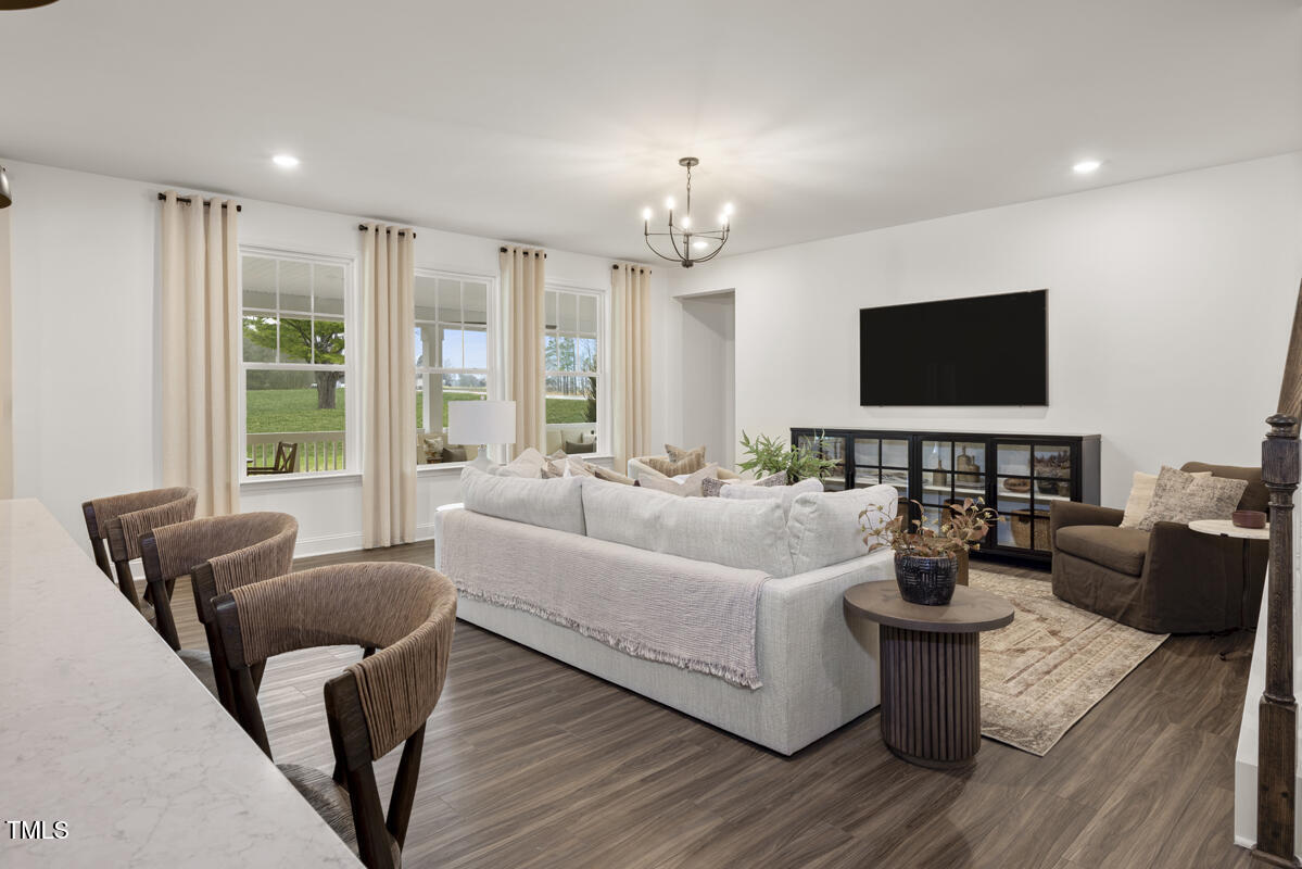 49 Alden Way Angier, NC 27501 - Photo 7 of 66 a living room with furniture and a flat screen tv