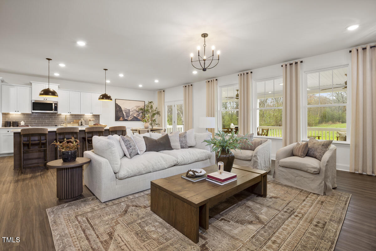 49 Alden Way Angier, NC 27501 - Photo 9 of 66 a living room with furniture kitchen view and a large window