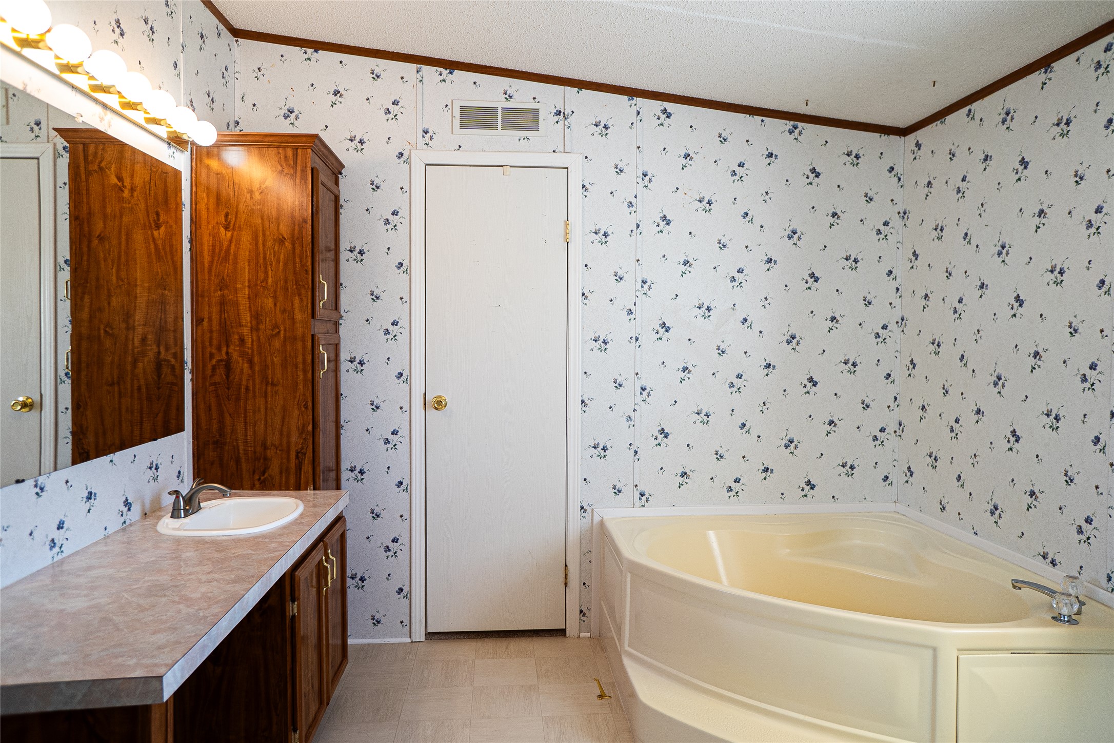 1149 Hart Lane Dripping Springs, TX 78620 - Photo 12 of 17 a bathroom with a bathtub and a shower