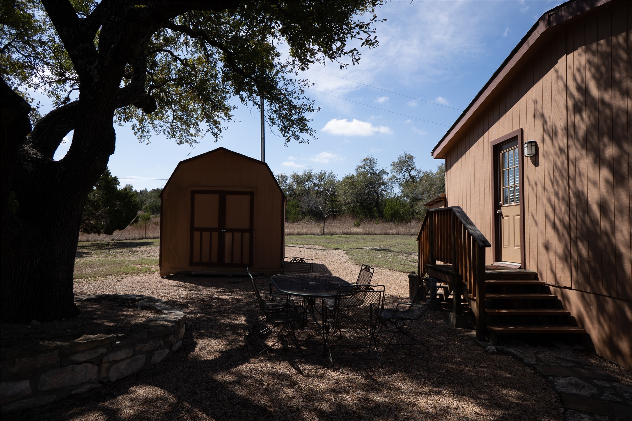 1149 Hart Lane Dripping Springs, TX 78620 - Photo 3 of 17 a backyard of a house with lots of green space