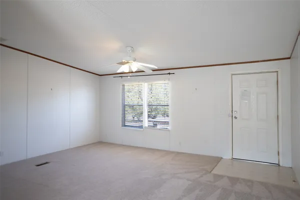 an empty room with a empty space and windows